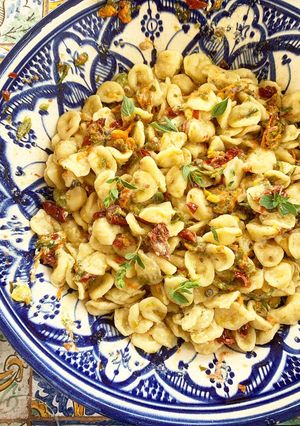 A picture of Orecchiette with Squash Blossoms, Sun-Dried Tomatoes, and Creamy Cacio Ricotta.