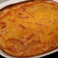 A picture of Smokey Taters w/ Cheese Sauce.