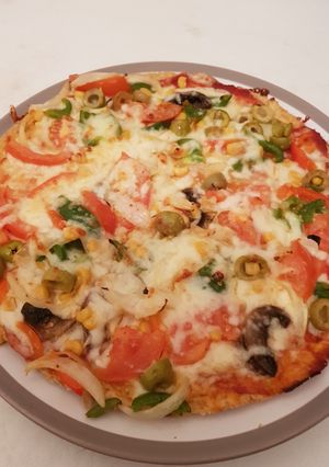 A picture of Grated bread eggs pizza.