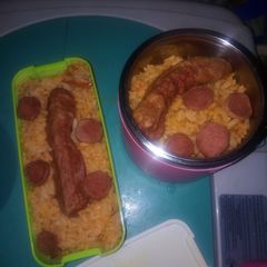 A picture of Jellof rice and sausage.
