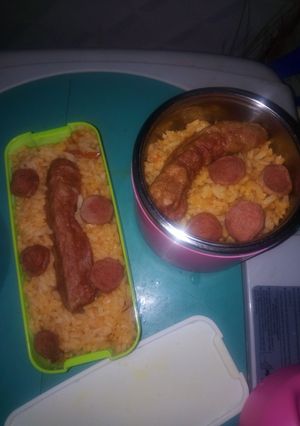 A picture of Jellof rice and sausage.