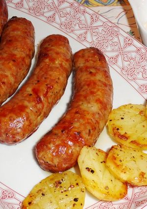 Foto principal de Chorizos criollos con patatas al horno