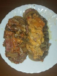 Una foto de Patatas asadas rellenas de beicon y queso en la olla GM g