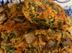 A picture of Baked carrot fritters with carrot tops - vegan.
