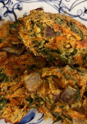 A picture of Baked carrot fritters with carrot tops - vegan.