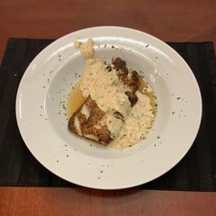 A picture of Grilled Cod with a Spicy Cream Sauce.