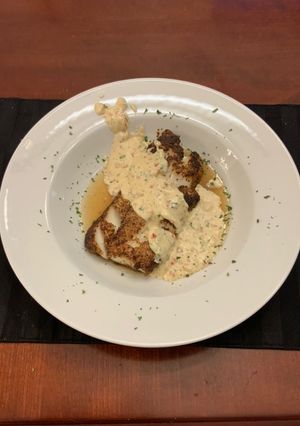 A picture of Grilled Cod with a Spicy Cream Sauce.