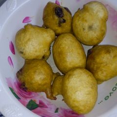 A picture of Puff puff with dry fruit.