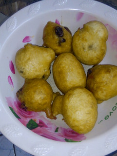 A picture of Puff puff with dry fruit.