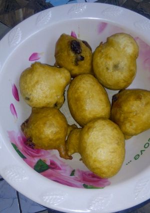 A picture of Puff puff with dry fruit.