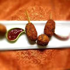 A picture of Paneer macaroni lolipops.