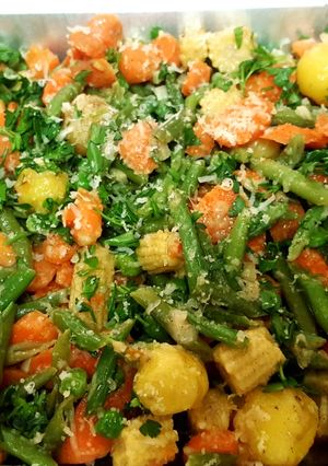 A picture of Garlic butter sautéed vegetables with parmesan cheese.