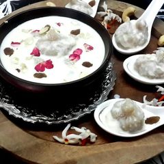 A picture of Steamed Coconut Dumplings in Kheer.
