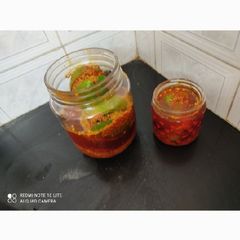 A picture of Whole mango pickle.