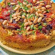 A picture of Maqluba (rice and vegetables).