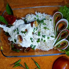 A picture of Chicken sizzler with garlic rice.