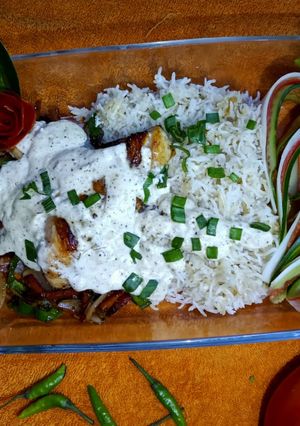A picture of Chicken sizzler with garlic rice.