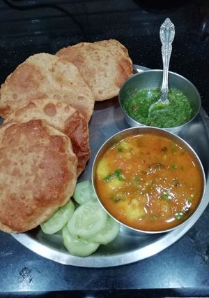 A picture of Moong Daal puri & Raseele Aloo.