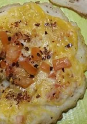 A picture of Cheesey tomato pitha.