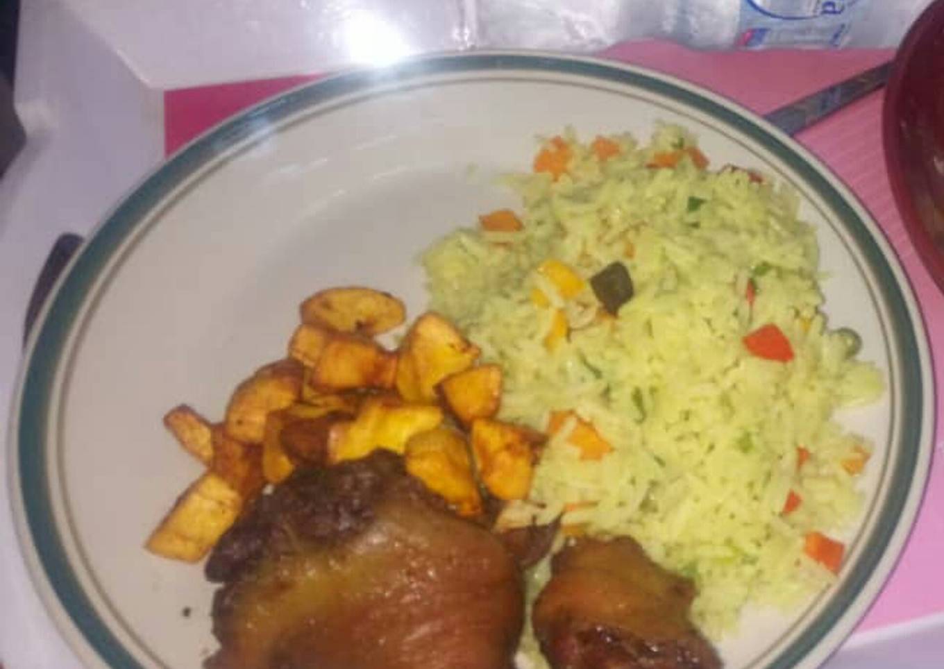 Fried rice,plantain amd fried chicken