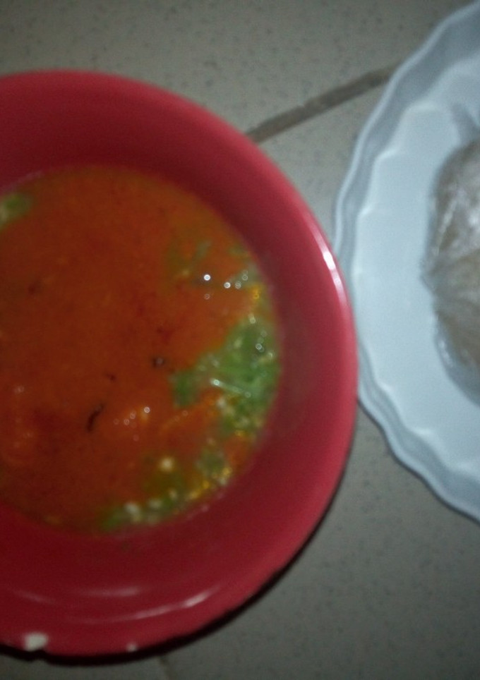 A picture of Okro with beef stew and Eba.