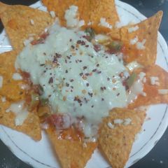A picture of Salsa cheesey nachos.