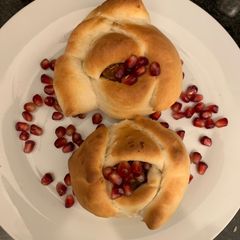 A picture of Dabeli Bun pav in Rose shape.