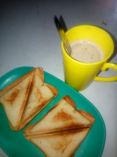 A picture of Tea and toasted bread.