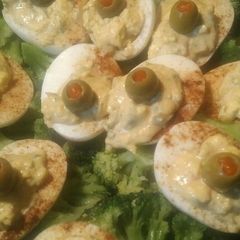 A picture of Deviled eggs and broccoli.