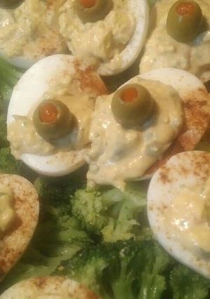 A picture of Deviled eggs and broccoli.