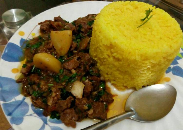 Tumeric rice served with beef stew