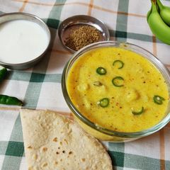 A picture of Dahi ka kela Curd with Raw banana.