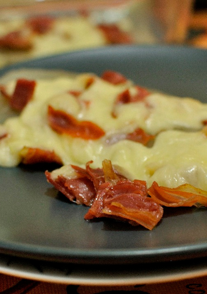 Una foto de Pencas de alcelgas con jamón y queso al horno
