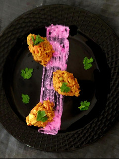 A picture of Vegetables Masala Khichdi With Pomogranate Curd.