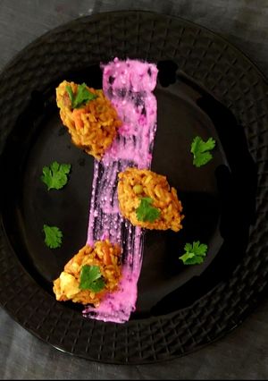 A picture of Vegetables Masala Khichdi With Pomogranate Curd.
