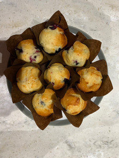 A picture of Lemon and blueberry drizzle muffins.