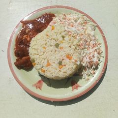 A picture of White rice and salad.