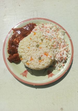 A picture of White rice and salad.