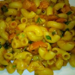 A picture of Creamy pasta with sausage bits.