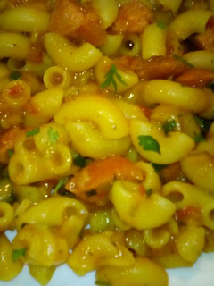 A picture of Creamy pasta with sausage bits.