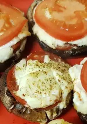 A picture of My Pizza style stuffed portobello mushrooms.