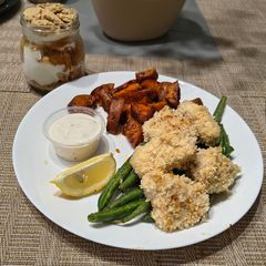 A picture of Southern Style Chicken Bites with Roasted Sweet Potatoes & Green Beans.