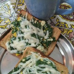 A picture of Open spinach cheese toast.