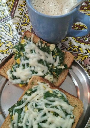 A picture of Open spinach cheese toast.