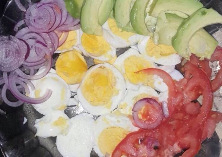 Boiled eggs served with kachumbari and avocado