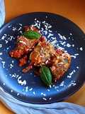 Baked Gnudi with Tomatoes, Mozzarella, and Ricotta Salata