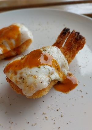 Una foto de Gambas langostinera "a la parmesana"