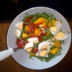 A picture of Mango, egg, lettuce salad.