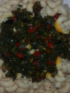 A picture of Pasta with green sauce.