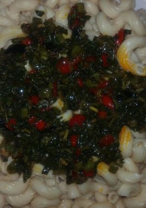 A picture of Pasta with green sauce.